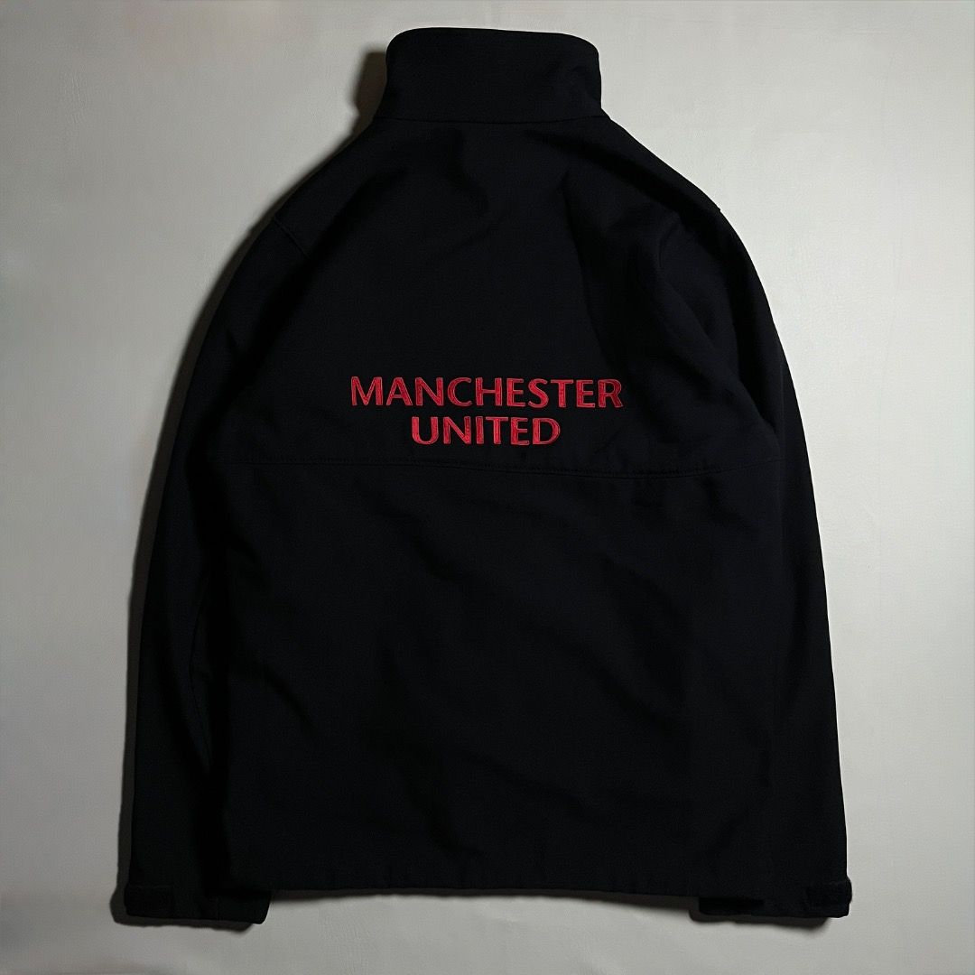 Columbia Manchester United Black Softshell Jacket Size S (Category: Coats, Jackets and Outerwear) located in Caloocan City. Submitted by achilles_grails (Listing ID 1470728467, Image 2). Description: - Official Columbia x Manchester United softshell jacket - Color: Clean solid black - Size: Small (tag attached) - Features: Full zip closure with high collar - Branding: Embroidered club crest on left chest, Columbia logo on right chest, and large M