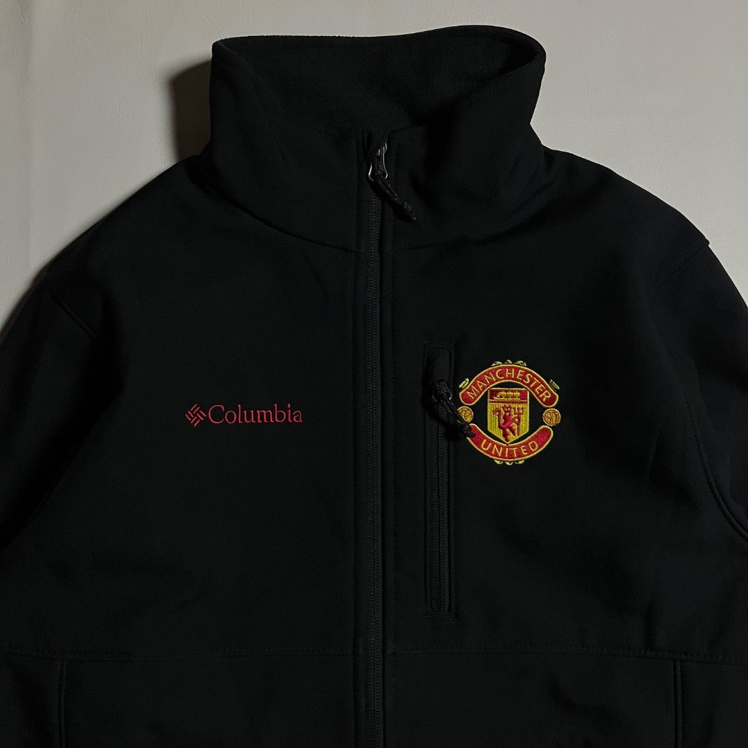 Columbia Manchester United Black Softshell Jacket Size S (Category: Coats, Jackets and Outerwear) located in Caloocan City. Submitted by achilles_grails (Listing ID 1470728467, Image 3). Description: - Official Columbia x Manchester United softshell jacket - Color: Clean solid black - Size: Small (tag attached) - Features: Full zip closure with high collar - Branding: Embroidered club crest on left chest, Columbia logo on right chest, and large M