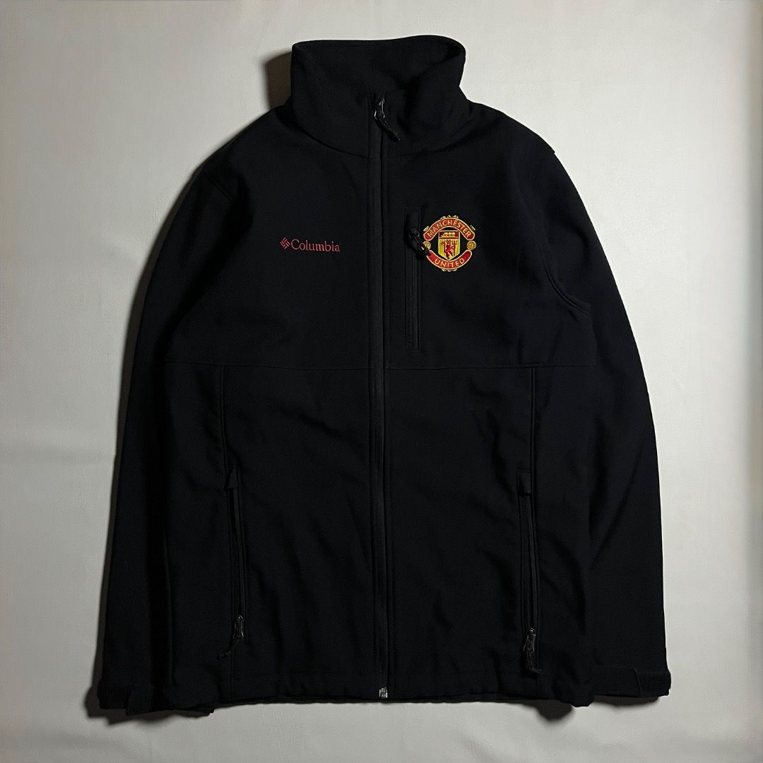 Columbia Manchester United Black Softshell Jacket Size S (Category: Coats, Jackets and Outerwear) located in Caloocan City. Submitted by achilles_grails (Listing ID 1470728467, Image 1). Description: - Official Columbia x Manchester United softshell jacket - Color: Clean solid black - Size: Small (tag attached) - Features: Full zip closure with high collar - Branding: Embroidered club crest on left chest, Columbia logo on right chest, and large M