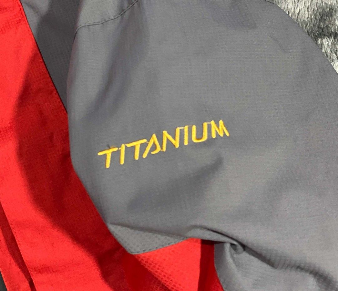 Columbia Titanium Red and Grey Hooded Jacket (Category: Coats, Jackets and Outerwear) located in Sorsogon. Submitted by johnmichae69459 (Listing ID 1470673480, Image 3). Description: - Brand: Columbia Titanium - Color: Bright red and grey colorblocking - Features: Hooded design, full zip front - medium to large - 24 width - 28 lenght closure with storm flap, dual zippered chest pockets, and branded snap buttons - Branding: Columbia Sportswear Com