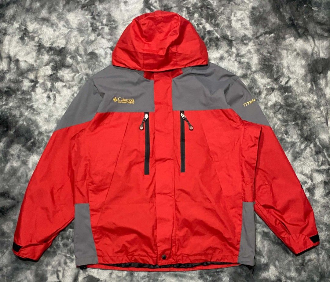 Columbia Titanium Red and Grey Hooded Jacket (Category: Coats, Jackets and Outerwear) located in Sorsogon. Submitted by johnmichae69459 (Listing ID 1470673480, Image 1). Description: - Brand: Columbia Titanium - Color: Bright red and grey colorblocking - Features: Hooded design, full zip front - medium to large - 24 width - 28 lenght closure with storm flap, dual zippered chest pockets, and branded snap buttons - Branding: Columbia Sportswear Com