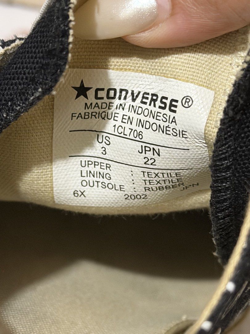 Comme des Garcons PLAY x Converse Multi-Heart Black Low Top (Category: Sneakers) located in Muntinlupa City. Submitted by biancaagbscloset (Listing ID 1470724140, Image 3). Description: Collaboration low top sneakers in black canvas. White graphic heart print with eyes pattern all over, plus the signature red heart on the side. Contrast white rubber toe cap and midsole. White laces through silver eyelets. Tag indicates size US 3 / JPN 22 CM.