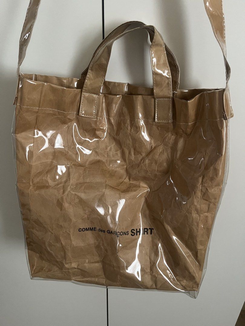 Comme des garcons PVC tote bag (Category: Tote Bags) located in Manila. Submitted by luv4fashion (Listing ID 1470596045, Image 1). Description: Comme des Garçons Tote Brown PVC Graphic Print Flat Handles & Single Shoulder Strap Canvas Lining & Single Interior Pocket Open Top.