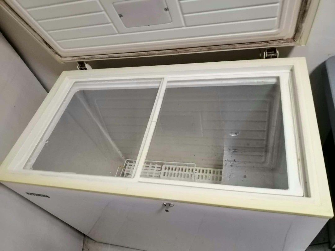 Condura CCF-200L Chest Freezer (Category: Refrigerators and Freezers) located in Marikina City. Submitted by wisebuytoo (Listing ID 1470622184, Image 2). Description: Condura 200L chest freezer, model CCF-200L. White exterior with sliding glass inner doors and storage basket inside. Runs on 230V, 60Hz. Standard capacity for food storage, extra freezing space for home or business needs. Clean interior, works great. Heavy appliance, pickup required