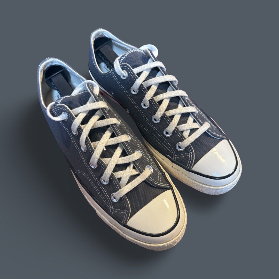 Converse Chuck 70 Low Dark Grey Sneakers (Category: Sneakers) located in Quezon City. Submitted by chey.mayuga (Listing ID 1470654631, Image 3). Description: - Model: Converse Chuck 70 Low Top - Color: Dark Grey canvas with off-white sole and black foxing stripe - Hardware: Silver metal eyelets with white laces - Features: Classic design, comfortable fit, and sturdy sole - Style: Versatile casual daily shoes.