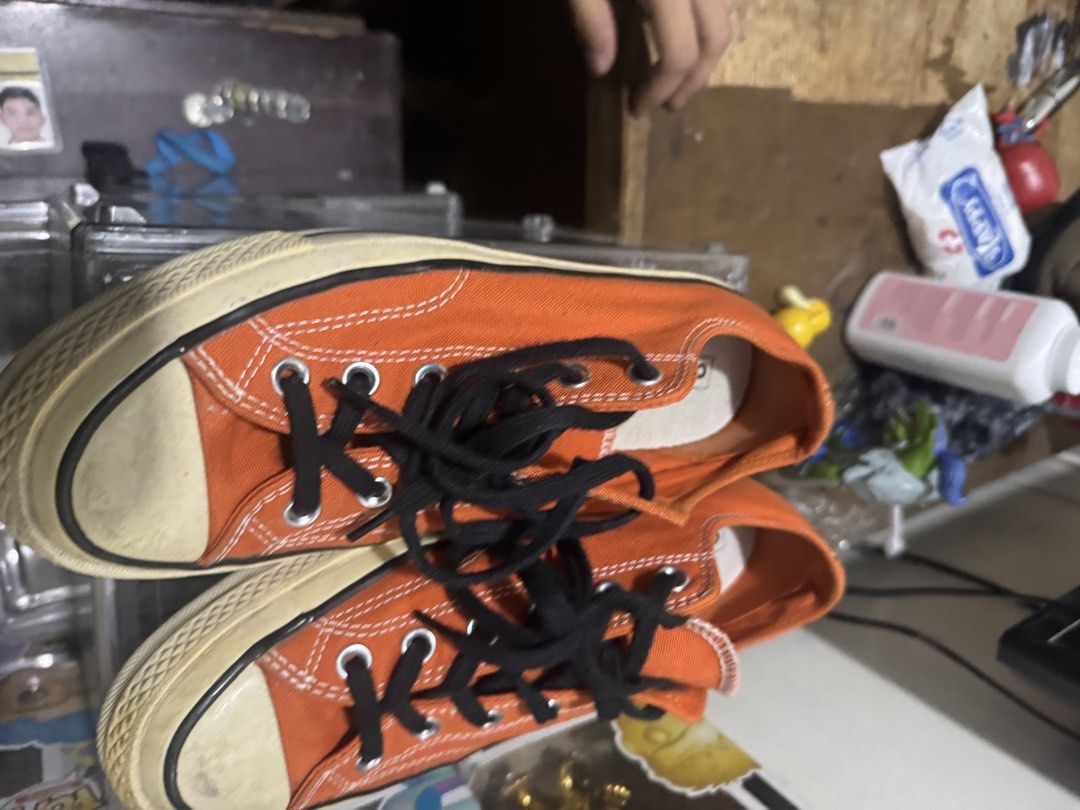 Converse Chuck 70 Ox Orange Size 7 mens (Category: Sneakers) located in Manila. Submitted by wiseearth.075b2f (Listing ID 1470623024, Image 3). Description: - Brand/Model: Converse Chuck 70 Ox - Color: Campfire Orange with black laces -₱1795 nego - Style: Low top canvas sneakers with classic vintage midsole and heel patches - Condition: Clean canvas upper, vibrant color, with minor wear on toe caps and outsoles - Status: Ready to wear.