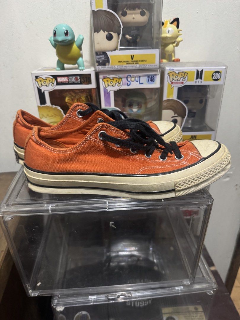 Converse Chuck 70 Ox Orange Size 7 mens (Category: Sneakers) located in Manila. Submitted by wiseearth.075b2f (Listing ID 1470623024, Image 2). Description: - Brand/Model: Converse Chuck 70 Ox - Color: Campfire Orange with black laces -₱1795 nego - Style: Low top canvas sneakers with classic vintage midsole and heel patches - Condition: Clean canvas upper, vibrant color, with minor wear on toe caps and outsoles - Status: Ready to wear.