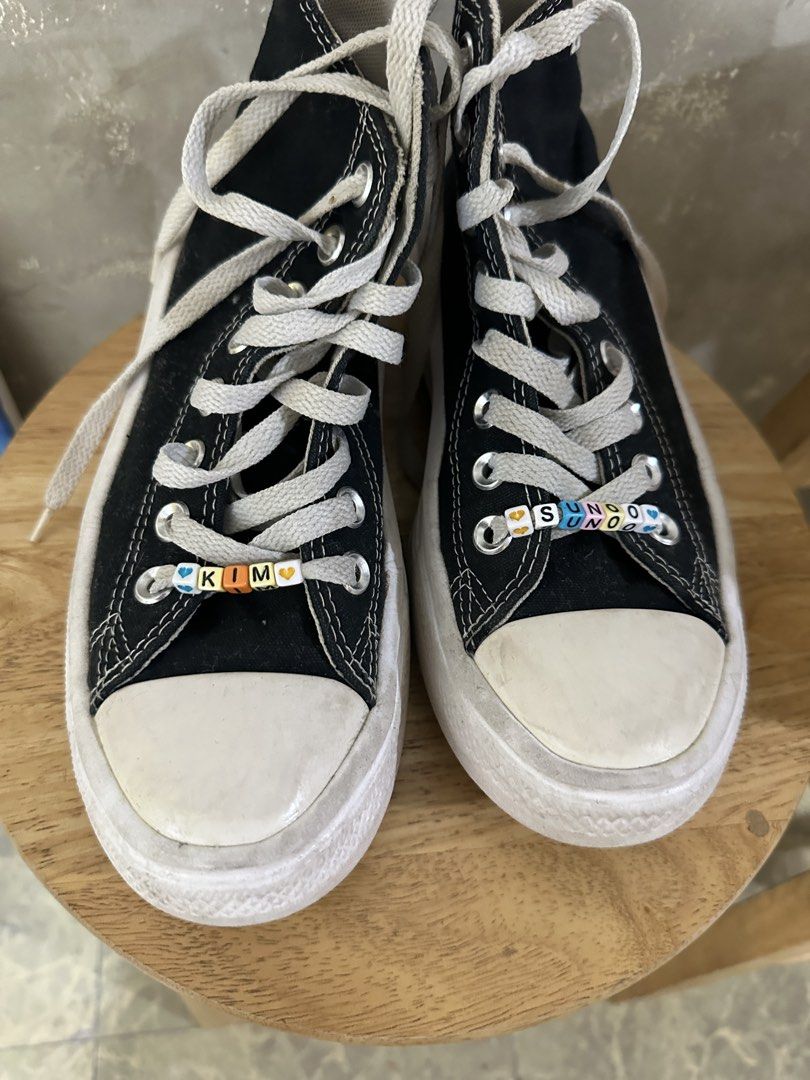 Converse Chuck Taylor All Star Black Platform High Top (Category: Sneakers) located in Cavite. Submitted by bordered (Listing ID 1470736269, Image 3). Description: Rfs: Decluttering Out grown by my Daughter Needs cleaning - Black canvas high top platform sneakers - Classic white rubber toe caps, platform soles, and white laces with metal eyelets - Customization: Letter beads spelling "KIM" and "SUNOO" threaded on the laces - Condition: Normal sig