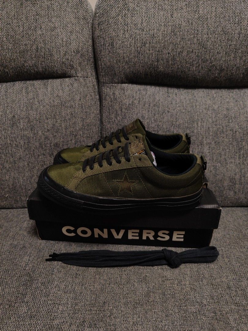 Converse x Carhartt WIP One Star Olive (Category: Sneakers) located in San Fernando. Submitted by cedrick_francisco27 (Listing ID 1470732705, Image 3). Description: - Model: Converse One Star x Carhartt WIP - Colorway: Olive Green with black soles - Material: Durable Cordura fabric upper - Inclusions: Original box and extra black laces with Carhartt-branded aglets - Features: Cushioned insoles with dual Converse and Carhartt branding - Style: Rug