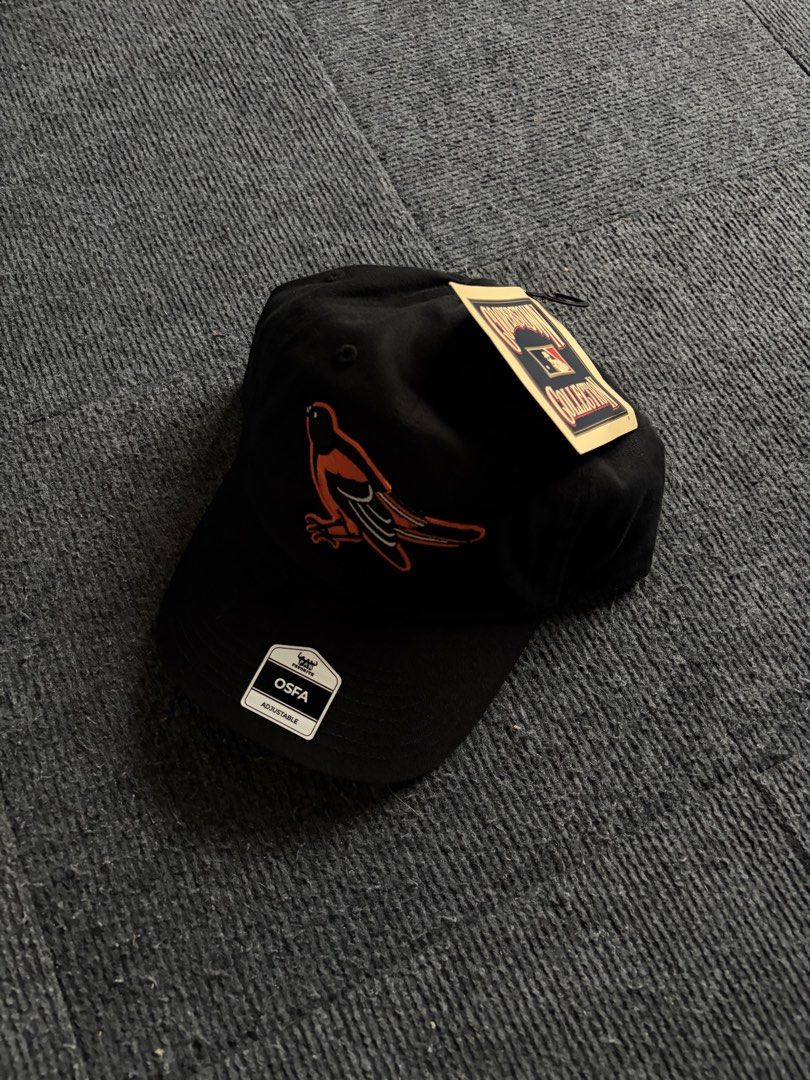 Cooperstown Collection MLB Black Baseball Cap Adjustable (Category: Caps & Hats) located in Manila. Submitted by toys_hats005 (Listing ID 1470629078, Image 1). Description: - Brand: Cooperstown Collection - Team: Baltimore Orioles (Embroidered bird logo) - Color: Black - Condition: Brand new with original tags and stickers - Size: OSFA (One Size Fits All) - Closure: Adjustable strap with metal buckle.