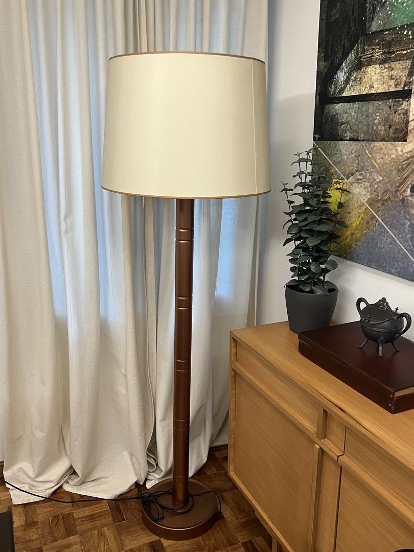 Copper floor lamp with beige drum shade and double pull chains (Category: Lighting) located in Manila. Submitted by pearlt455 (Listing ID 1470562267, Image 1). Description: Metallic copper finish tall floor lamp Condition: Used-Good Lamp Post: Height: 65.5in. Beige Drum Shade: Height: 15in., Diameter: 19in. - Wide beige fabric drum shade included - Dual bulb sockets with individual pull chains - Fully working condition with LED light bulbs includ