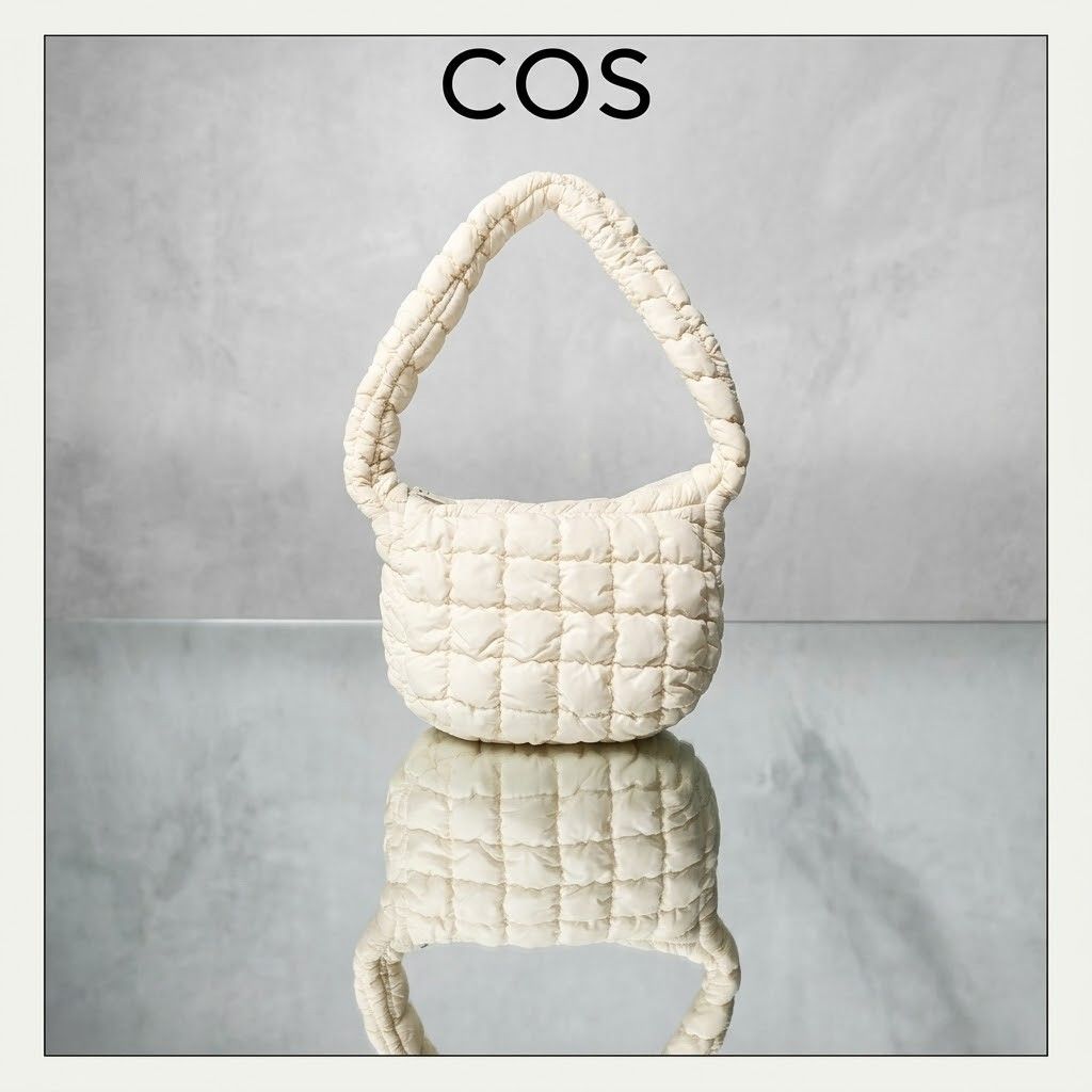 COS Quilted Cloud Mini Shoulder Bag Off White (Category: Shoulder Bags) located in Carmen. Submitted by ar_thrift00 (Listing ID 1470560935, Image 1). Description: - Authentic COS quilted shoulder bag in a versatile off-white shade - Super soft padded fabric with stylish all-over grid stitching - Lightweight and extremely roomy for all your daily essentials - Secure top zipper closure to keep your items safe - Comfortable single shoulder strap for