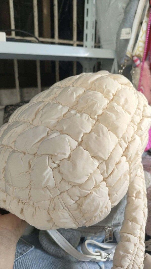 COS Quilted Cloud Mini Shoulder Bag Off White (Category: Shoulder Bags) located in Carmen. Submitted by ar_thrift00 (Listing ID 1470560935, Image 2). Description: - Authentic COS quilted shoulder bag in a versatile off-white shade - Super soft padded fabric with stylish all-over grid stitching - Lightweight and extremely roomy for all your daily essentials - Secure top zipper closure to keep your items safe - Comfortable single shoulder strap for
