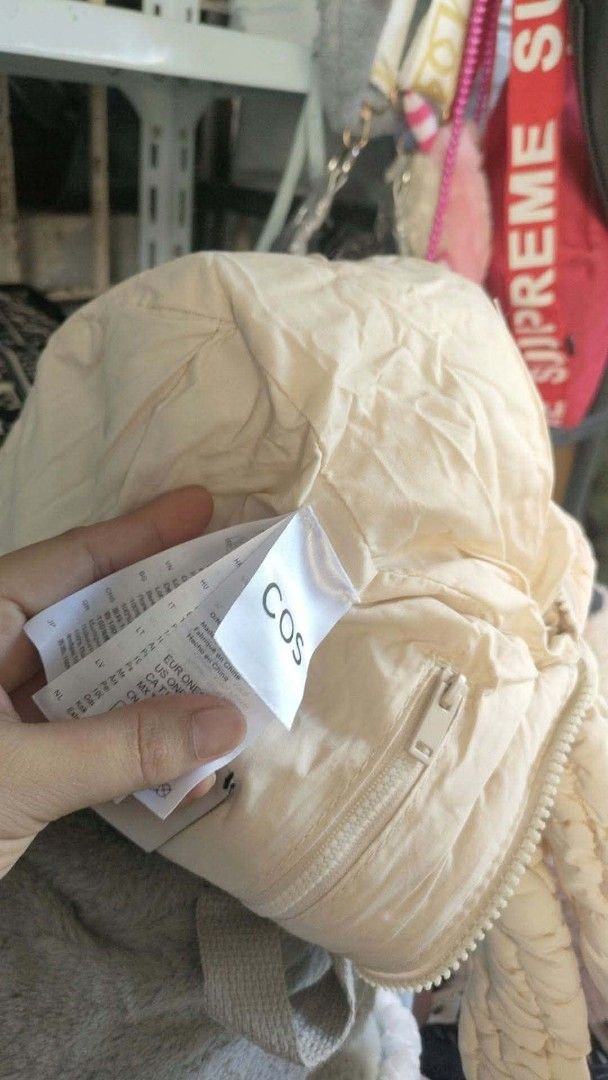 COS Quilted Cloud Mini Shoulder Bag Off White (Category: Shoulder Bags) located in Carmen. Submitted by ar_thrift00 (Listing ID 1470560935, Image 3). Description: - Authentic COS quilted shoulder bag in a versatile off-white shade - Super soft padded fabric with stylish all-over grid stitching - Lightweight and extremely roomy for all your daily essentials - Secure top zipper closure to keep your items safe - Comfortable single shoulder strap for