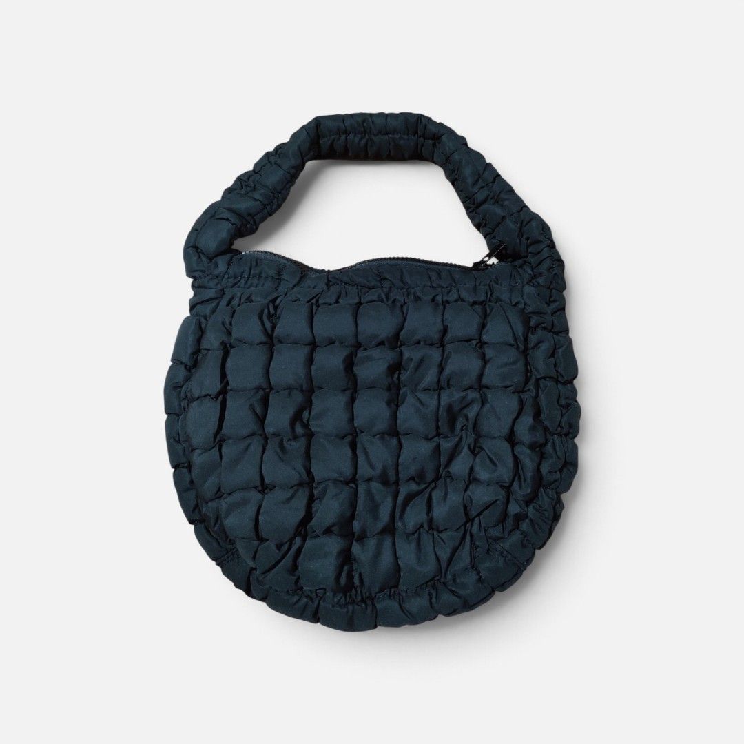 COS Quilted Mini Bag Black (Category: Luxury Bags & Wallets) located in Puerto Princesa. Submitted by thriftedsoulsy2k (Listing ID 1470675691, Image 1). Description: - Brand: COS - Style: Quilted mini bag in classic black - Design: Signature puffy quilted texture with sleek minimalist look - Features: Top zip closure and comfortable padded handle - Capacity: Spacious enough for your daily essentials - Condition: Interior label intact - Origin: Ma