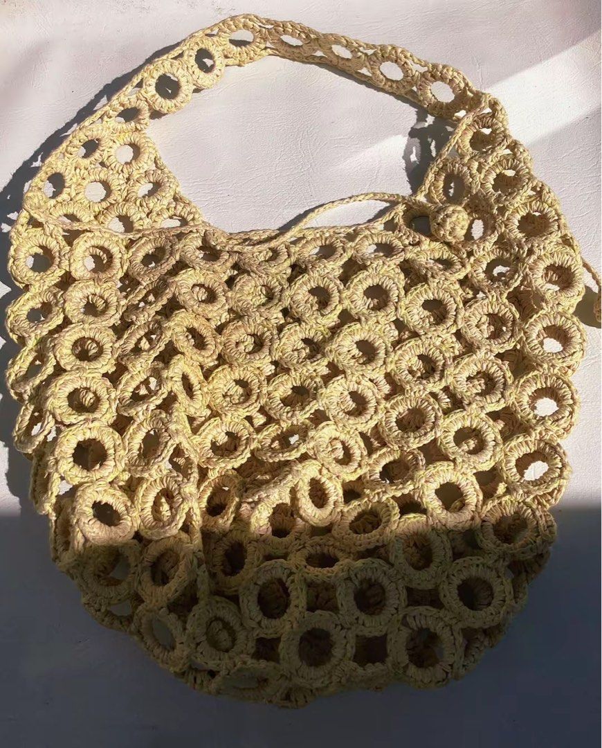 Cream Crochet Circle Pattern Shoulder Bag Beach Bag (Category: Shoulder Bags) located in Baguio. Submitted by unaesthetic_version (Listing ID 1470730127, Image 1). Description: P.S🌸 May ink stain suya sa loob, check the photos nalang - Cream crochet shoulder bag with stylish interlocking round ring motifs - Open mesh knit design for a breezy, lightweight feel - Soft and slouchy shape that holds your daily essentials - Drawstring closure finished