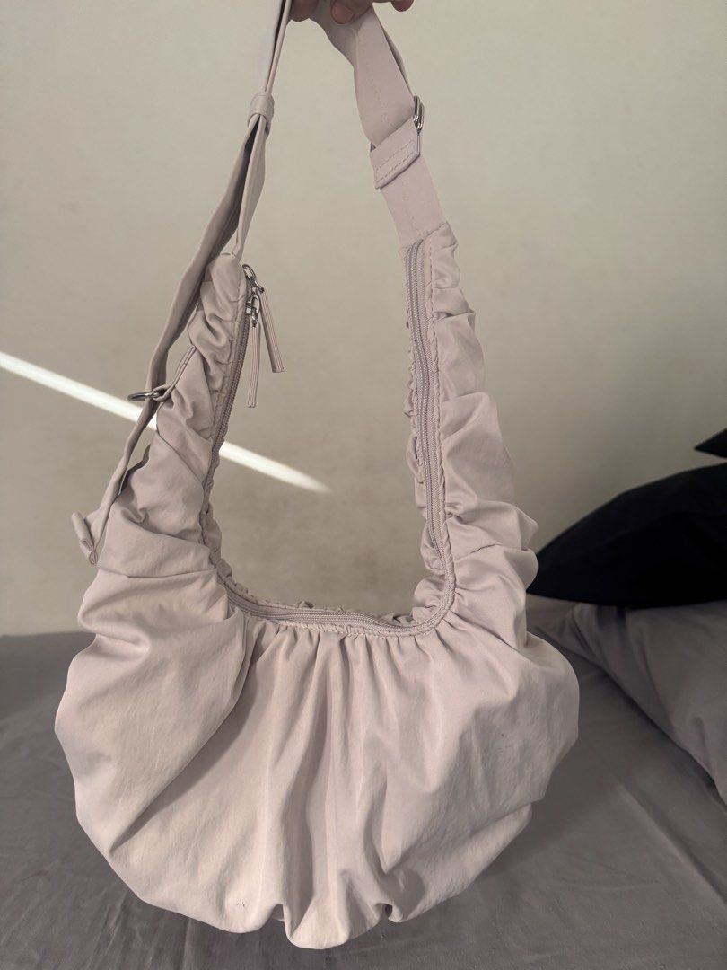 Cream Ruched Slouchy Shoulder Bag with Adjustable Strap (Category: Shoulder Bags) located in Cebu City. Submitted by jsk-finds (Listing ID 1470632410, Image 1). Description: - Color: Cream - Style: Lightweight slouchy shoulder bag with heavy ruched detailing - Closure: Secure top zipper - Interior: Clean lined interior with an open slip pocket - Hardware: Silver-tone, adjustable strap - Condition: Excellent, clean interior and exterior with no ma