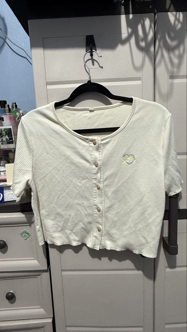 Cream Semi Cropped Knitted Shirt (Category: Shirts) located in Quezon City. Submitted by dinesaur (Listing ID 1470677874, Image 1). Description: Heart buttons.