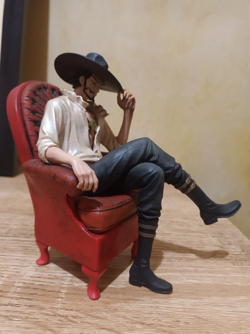 Creator x Creator Dracule Mihawk One Piece Figure (Category: Figurines & Statues) located in Bacarra. Submitted by acobasherw74134 (Listing ID 1470577556, Image 2). Description: - Character: Dracule Mihawk from One Piece - Pose: Relaxed in a red armchair - Outfit: Signature hat, cross pendant necklace, unbuttoned white shirt, black pants, and tall boots - Condition: Clean paintwork, loose (no box included) - Ideal for: Anime figure collectors and