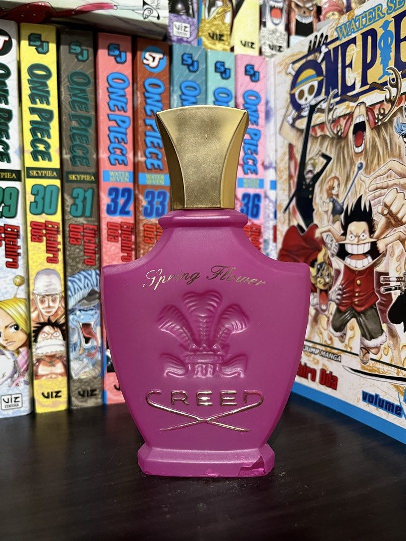 Creed Spring Flower Pink Perfume Bottle (Category: Fragrance & Deodorants) located in Manila. Submitted by hankim24 (Listing ID 1470649725, Image 1). Description: - Authentic Creed Spring Flower fragrance bottle - Vibrant pink color with elegant gold-tone cap - Features a chic raised emblem design with gold lettering - Perfect decorative display piece or vanity prop - Note: Empty bottle with a minor chip on the bottom edge.