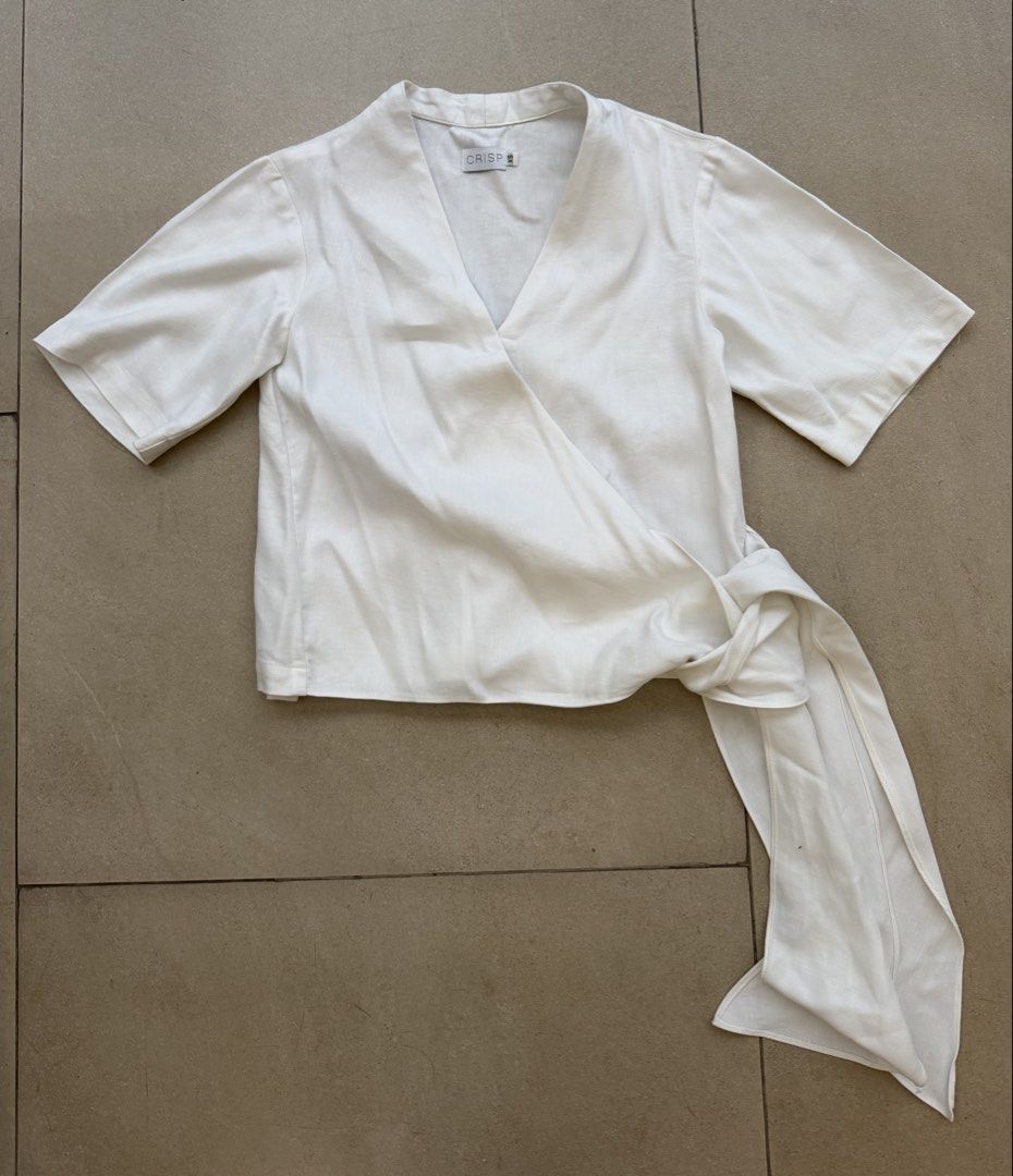 Crisp wrap around style top xs (Category: Blouses) located in Quezon City. Submitted by closet.cha (Listing ID 1470595917, Image 2). Description: *PLEASE READ DESCRIPTION, DO NOT MAKE AN OFFER IF YOU ARE NOT SURE* Size: Xs Good condition No return no exchange No haggle and low baller offers. No other photos or when worn for flat lays. No Meet-Ups No Cash on Delivery No Pera Padala at the moment. 🖊Please pay on time. No to joy reservers.🖊 *If no