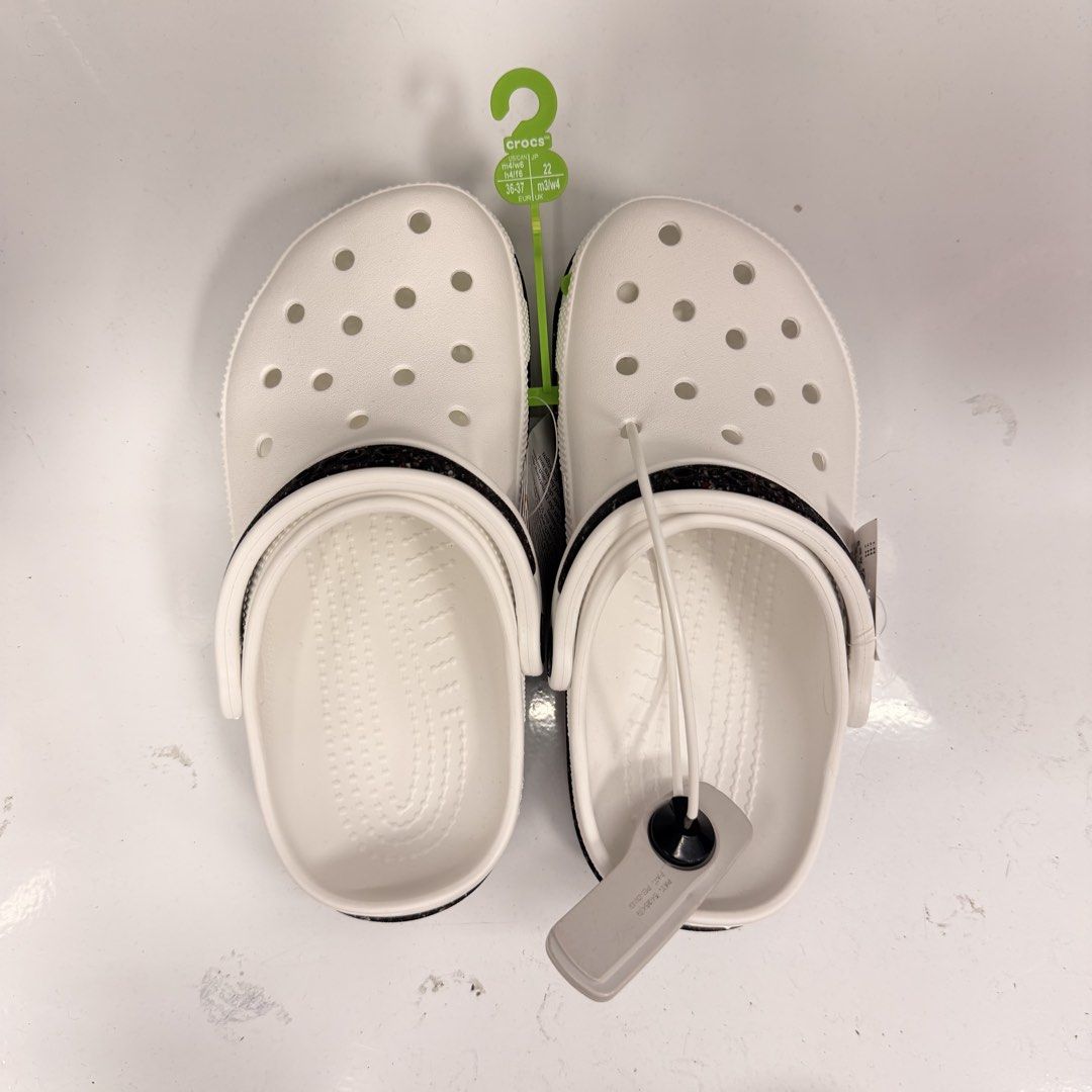 Crocs Classic Clogs Multiple Colors Sizes Available (Category: Slippers and slides) located in Manila. Submitted by thriftsbyfelas (Listing ID 1470672977, Image 2). Description: - 100% Brand new with original retail and security tags attached - Available Colors: Beige, White with printed strap, and Pink - Iconic Crocs comfort footbed for all-day support - Ventilation holes on top for enhanced breathability - Pivoting heel straps for a more secure