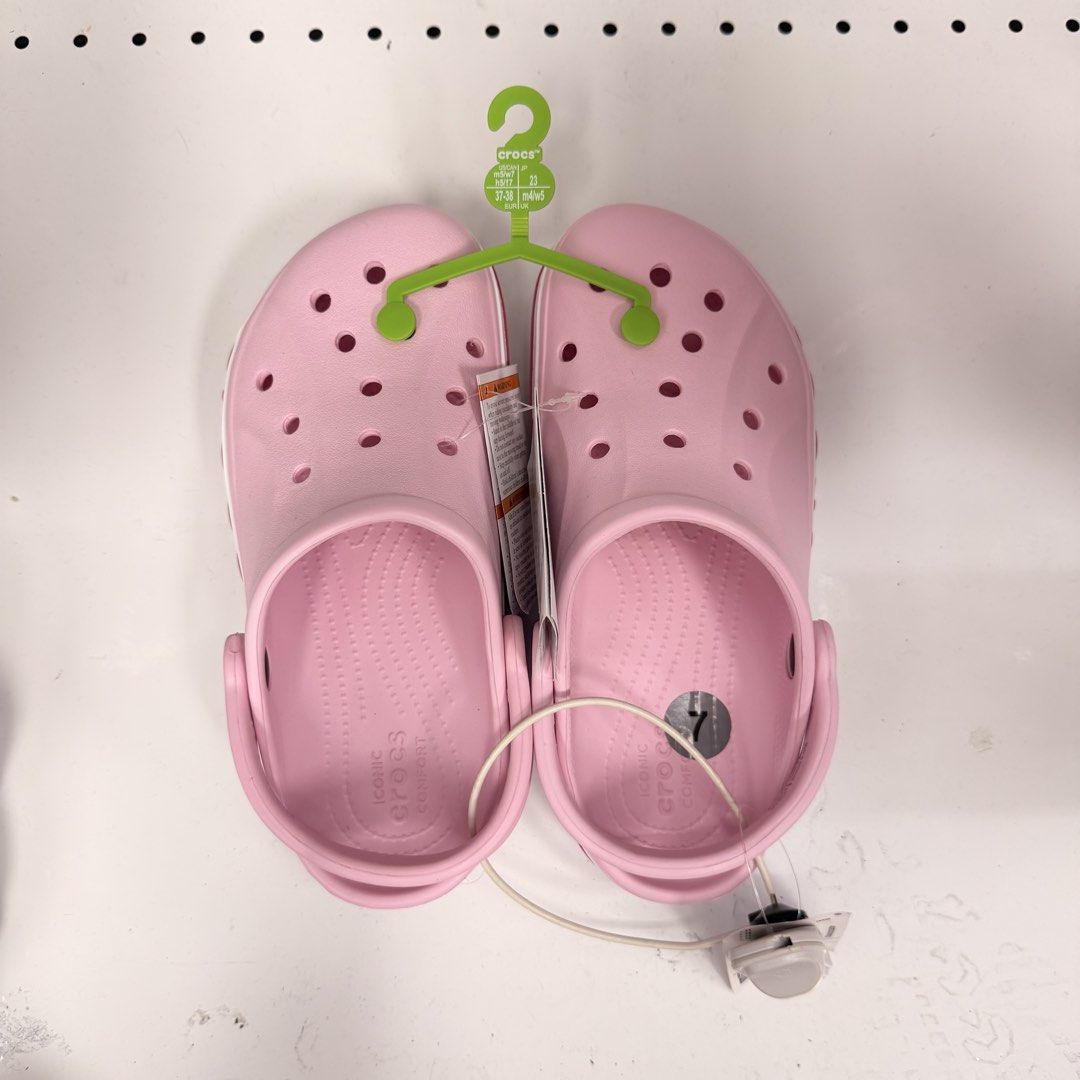 Crocs Classic Clogs Multiple Colors Sizes Available (Category: Slippers and slides) located in Manila. Submitted by thriftsbyfelas (Listing ID 1470672977, Image 3). Description: - 100% Brand new with original retail and security tags attached - Available Colors: Beige, White with printed strap, and Pink - Iconic Crocs comfort footbed for all-day support - Ventilation holes on top for enhanced breathability - Pivoting heel straps for a more secure