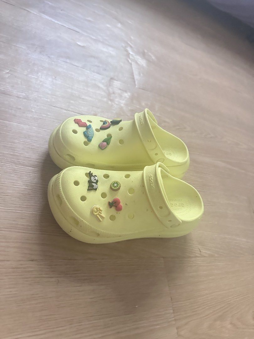 Crocs Original (Category: Slippers and slides) located in Bulacan. Submitted by shandi1987 (Listing ID 1470599845, Image 1). Description: - Brand: Original Crocs - Color: Pastel Yellow - Size: Men's 8 / Women's 10 (M8/W10) - Condition: Good pre-loved condition - Features: Pre-accessorized with cute multi-colored Jibbitz charms (panda, rainbow, pineapple, etc.) - Perfect for casual daily wear, lightweight and comfortable Iconic Crocs Comfort.