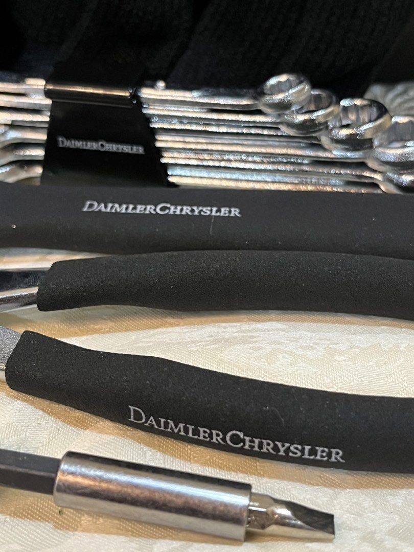 DaimlerChrysler Branded Tool Set with Carrying Case (Category: Construction Tools & Equipment) located in Dasmarinas. Submitted by emmakim08 (Listing ID 1470596172, Image 1). Description: - Official DaimlerChrysler branded tool kit - Compact black roll-up organizer with dual buckle straps and metal logo plaque - Includes essential tools: wrenches, screwdrivers, and pliers - Ergonomic black rubberized grips for comfortable handling - Built-in hand