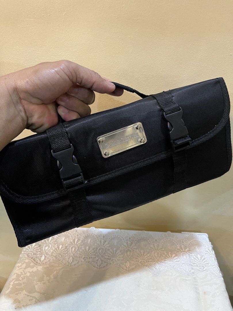 DaimlerChrysler Branded Tool Set with Carrying Case (Category: Construction Tools & Equipment) located in Dasmarinas. Submitted by emmakim08 (Listing ID 1470596172, Image 2). Description: - Official DaimlerChrysler branded tool kit - Compact black roll-up organizer with dual buckle straps and metal logo plaque - Includes essential tools: wrenches, screwdrivers, and pliers - Ergonomic black rubberized grips for comfortable handling - Built-in hand