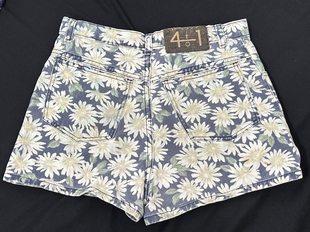 Daisy Print High-Waisted Denim Shorts (Category: Shorts) located in Las Pinas. Submitted by __aqdclttrs (Listing ID 1470616612, Image 2). Description: - High-waisted denim shorts by 4+1. They're quite cheeky - Classic five-pocket design. - Some blue paint stains on the front left leg and a small pinkish mark on the back right pocket. - Flat waist measures around 13.5 to 14 inches. Best fits 24-25 inches.