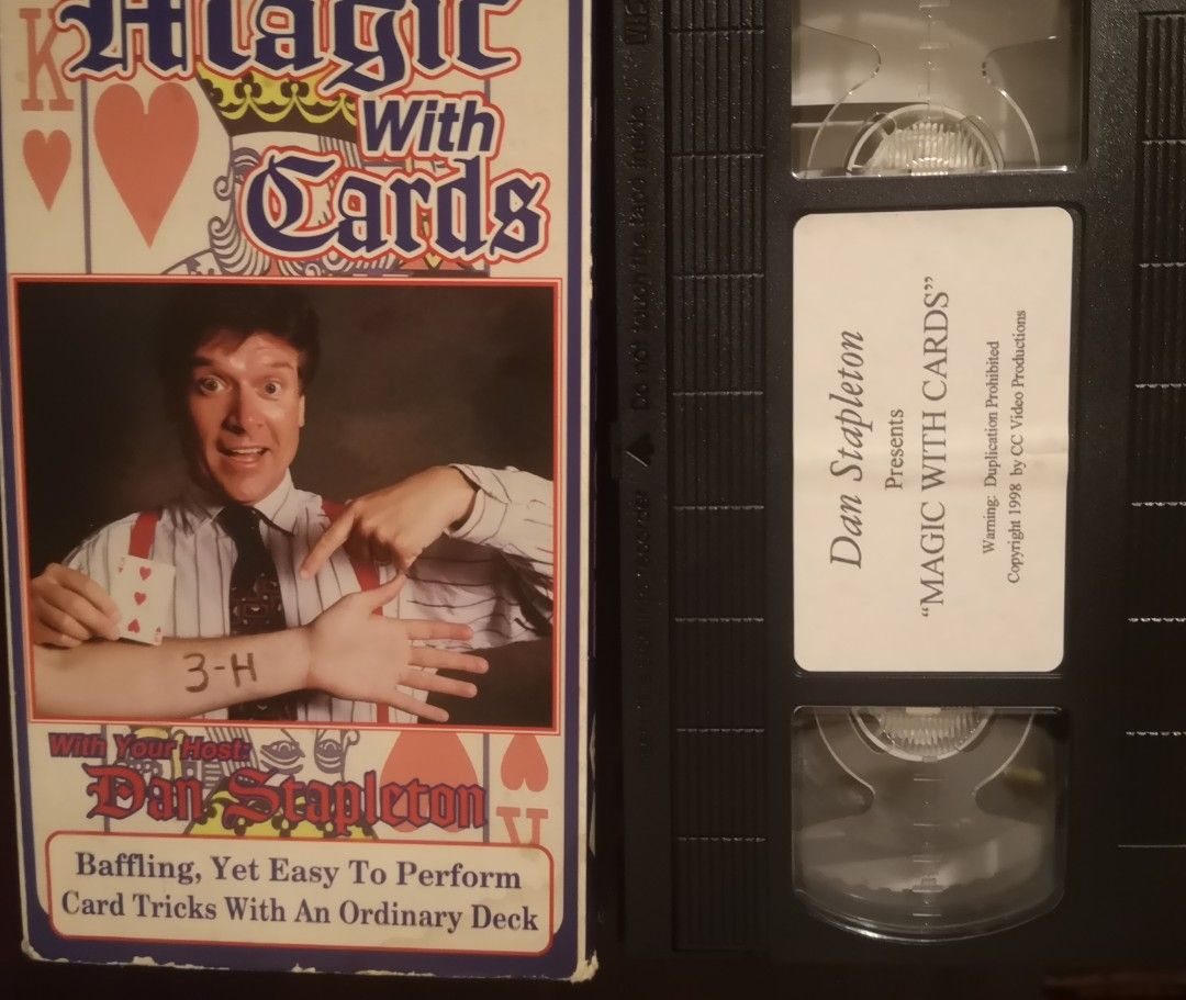 Dan Stapleton Presents Magic With Cards VHS Tape (Category: Vintage Collectibles) located in Quezon City. Submitted by dhanie.barican (Listing ID 1470717998, Image 3). Description: - Title: Magic With Cards VHS hosted by Dan Stapleton - Content: Learn baffling yet easy-to-perform card tricks using an ordinary deck - Release Year: 1998 by CC Video Productions - Condition/Includes: Original cardboard slipcase and tape with custom label - Ideal For: