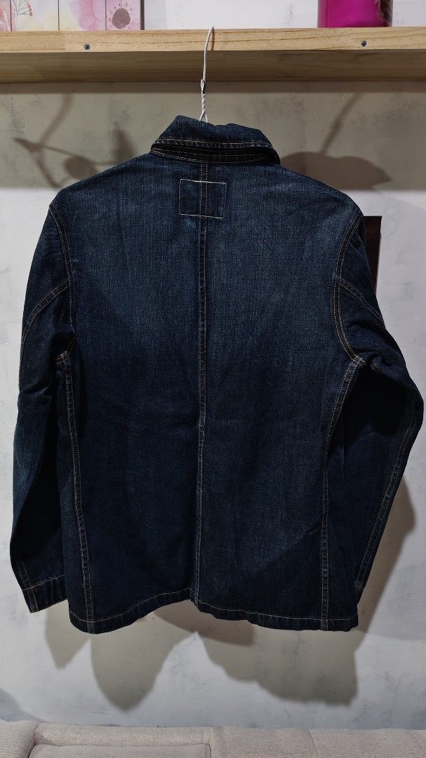Dark Denim Chore Jacket Workwear Coat (Category: Coats, Jackets and Outerwear) located in Quezon City. Submitted by truedeer_cda94c (Listing ID 1470608613, Image 2). Description: - Dark wash denim chore jacket with striking contrast stitching - Features four front utility pockets for practicality - Classic button-up front with a structured collar and straight hem - Measurements: 21" across chest x 27" in length - Perfect layering piece to keep yo