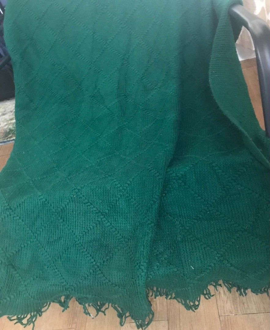 Dark green knitted throw blanket with fringe (Category: Bedding & Towels) located in Imus. Submitted by stop_shop7 (Listing ID 1470621655, Image 2). Description: - Color: Rich forest green - Design: Deep diamond knit pattern with textured borders and long fringe - Ideal for: Draping over sofas or armchairs to add a cozy touch - Need wash.