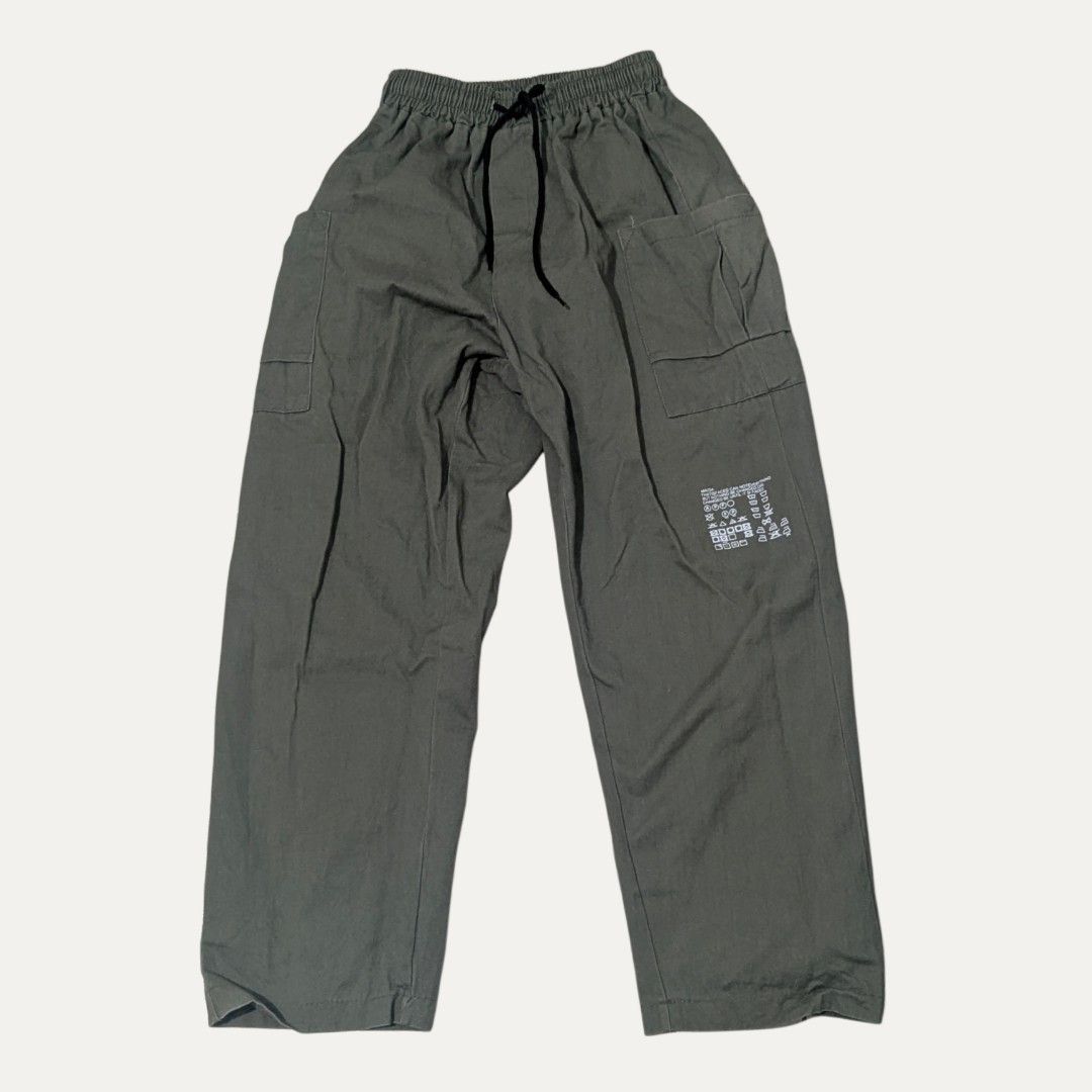 Faded Green Cargo Pants with Elastic Drawstring Waist (Category: Trousers) located in Manila. Submitted by _neku (Listing ID 1470742169, Image 1). Description: 33 length 30 waist stretchable excellent condition .