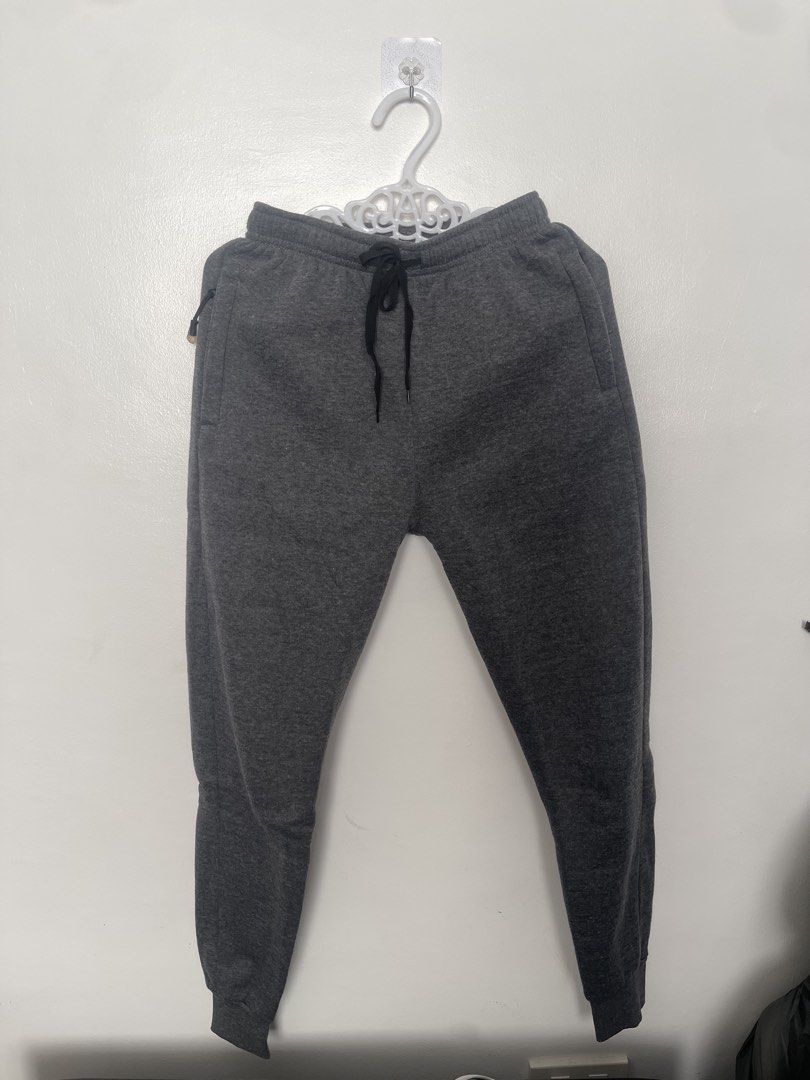 Dark Grey Jogger Sweatpants with Zipper Pockets (Category: Other Bottoms) located in Manila. Submitted by lovedbymidge (Listing ID 1470637502, Image 1). Description: 🩷 for m-l girlies (worn twice, in good condition) 🚚 lalamove or grab express (sf shouldered by the buyer!) - Color: Dark grey - Material: Soft cotton blend - Waistband: Elastic with adjustable black drawstring - Pockets: Secure zippered side pockets for phone and keys - Cuffs: Ribb