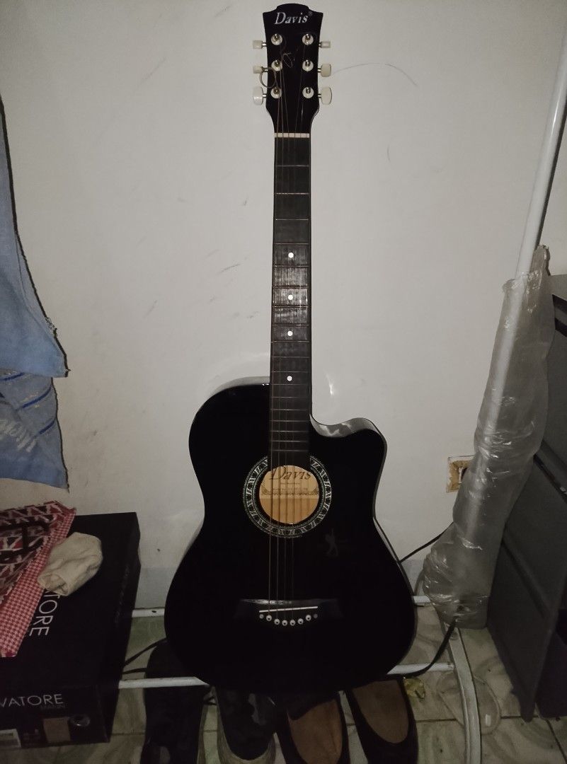 Davis Guitar (Category: Musical Instruments) located in Caloocan City. Submitted by ___kel (Listing ID 1470643499, Image 1). Description: second hand guitar with free capo and strings slightly negotiable.