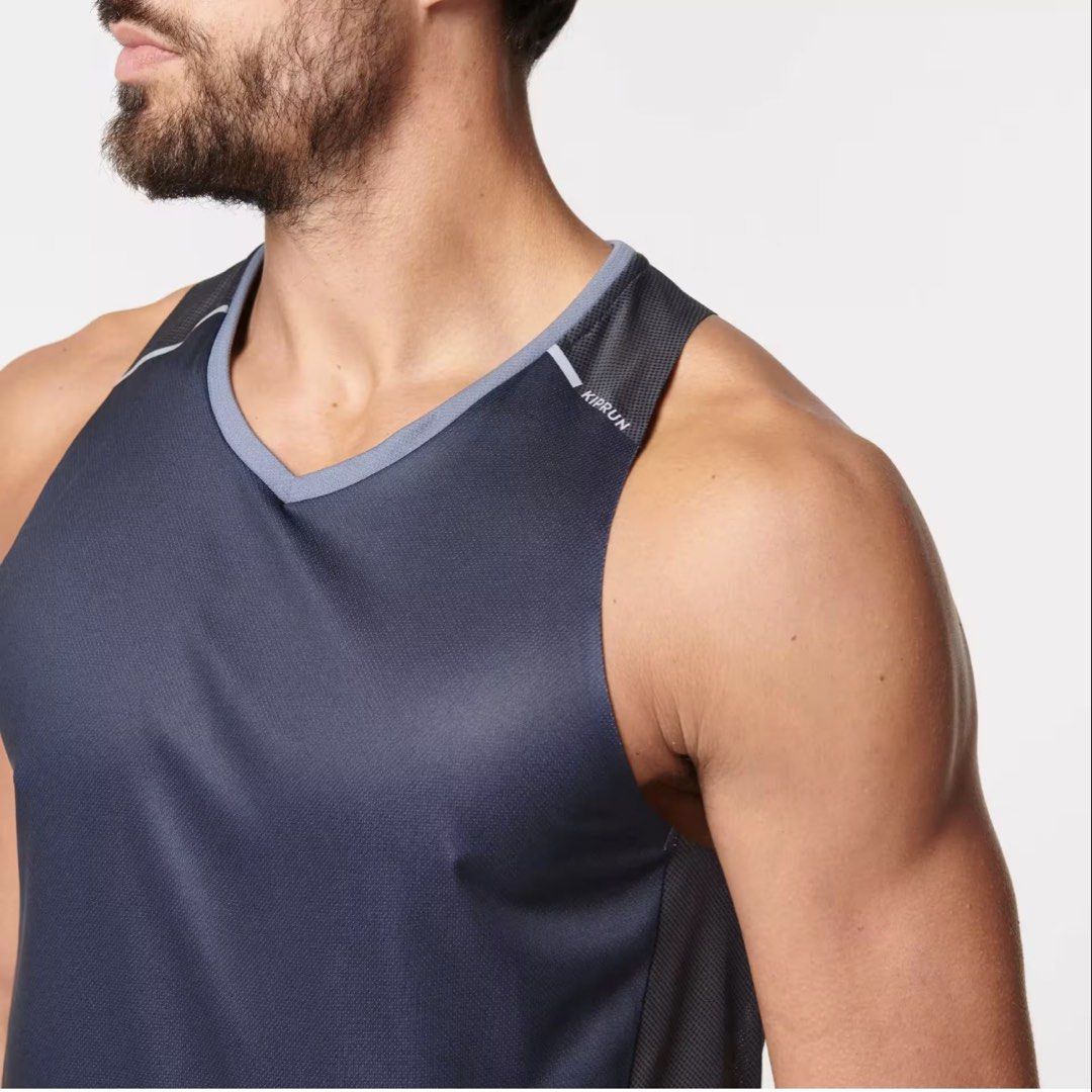 Decathlon Kiprun Chafree-Light Running Tank Top (Category: Activewear) located in Davao. Submitted by eyedea300064714 (Listing ID 1470638944, Image 2). Description: - Brand/Model: Decathlon Kiprun Men's Running Singlet - Color: Dark grey and blue tones - Fabric: Lightweight mesh with anti-chafing construction for maximum comfort - Safety: Reflective details on shoulders and back spine for night runs - Design: V-neck cut, sleeveless, standard men'