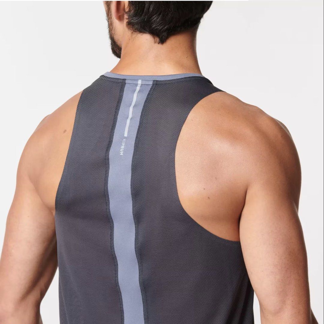 Decathlon Kiprun Chafree-Light Running Tank Top (Category: Activewear) located in Davao. Submitted by eyedea300064714 (Listing ID 1470638944, Image 3). Description: - Brand/Model: Decathlon Kiprun Men's Running Singlet - Color: Dark grey and blue tones - Fabric: Lightweight mesh with anti-chafing construction for maximum comfort - Safety: Reflective details on shoulders and back spine for night runs - Design: V-neck cut, sleeveless, standard men'