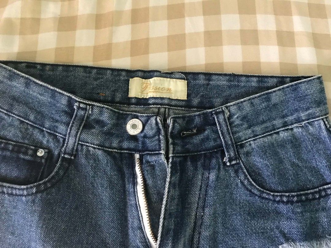 Denim Blue Distressed Jeans (Category: Jeans) located in Quezon City. Submitted by mysticowl.972175 (Listing ID 1470617294, Image 2). Description: - Brand: Passion Size: S - Wash: Medium wash denim - Style: Straight leg cut with zip fly and button closure - Condition: Great casual piece for everyday outfits.