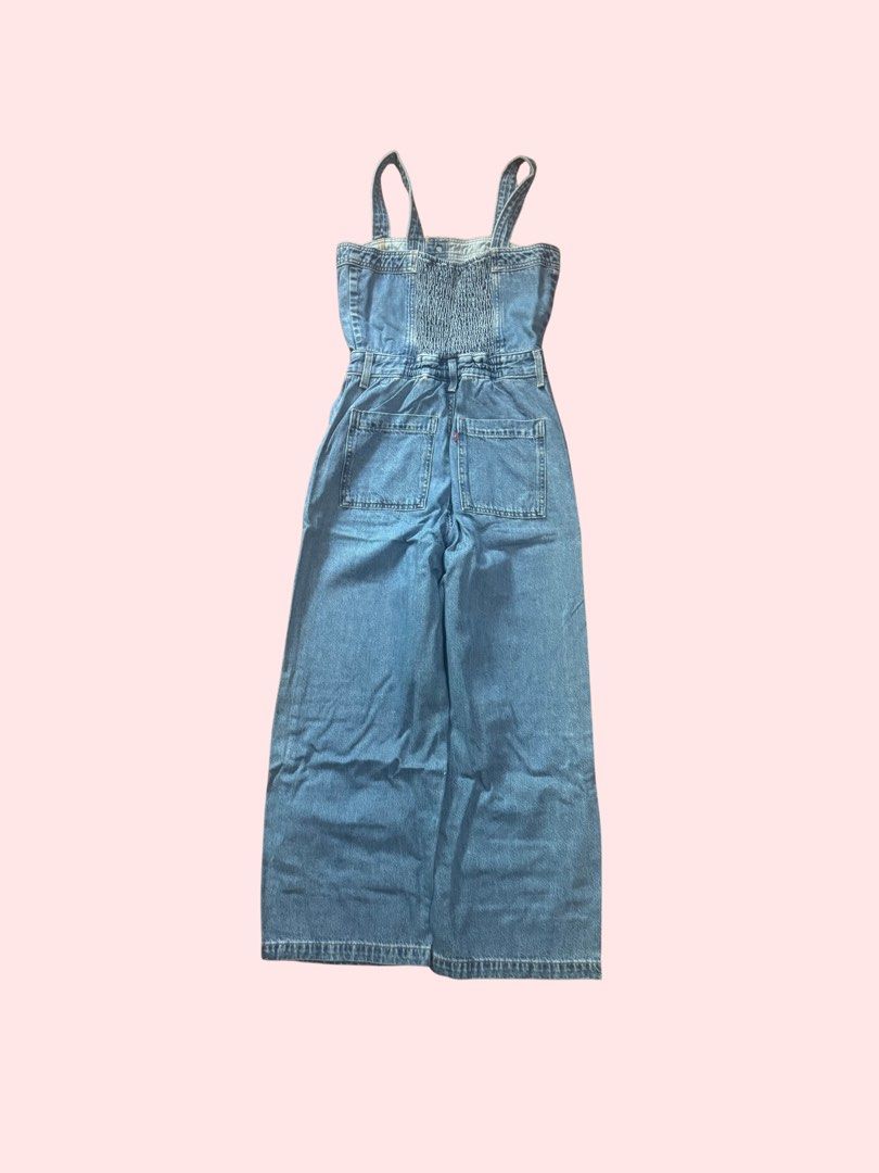 Denim Jumpsuit Wide Leg (Category: Jumpsuits) located in Pasig City. Submitted by kia.sell (Listing ID 1470655676, Image 2). Description: - Brand: Levi’s (100% Authentic) - Style: Sleeveless button-front wide-leg denim jumpsuit / overalls - Color: Mid-Wash Blue - Design Details: Structured corset-style bodice with button-down front accents, thick non-adjustable denim shoulder straps, fitted high waist with belt loops, deep side slant pockets, and