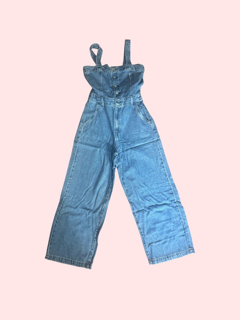 Denim Jumpsuit Wide Leg (Category: Jumpsuits) located in Pasig City. Submitted by kia.sell (Listing ID 1470655676, Image 1). Description: - Brand: Levi’s (100% Authentic) - Style: Sleeveless button-front wide-leg denim jumpsuit / overalls - Color: Mid-Wash Blue - Design Details: Structured corset-style bodice with button-down front accents, thick non-adjustable denim shoulder straps, fitted high waist with belt loops, deep side slant pockets, and