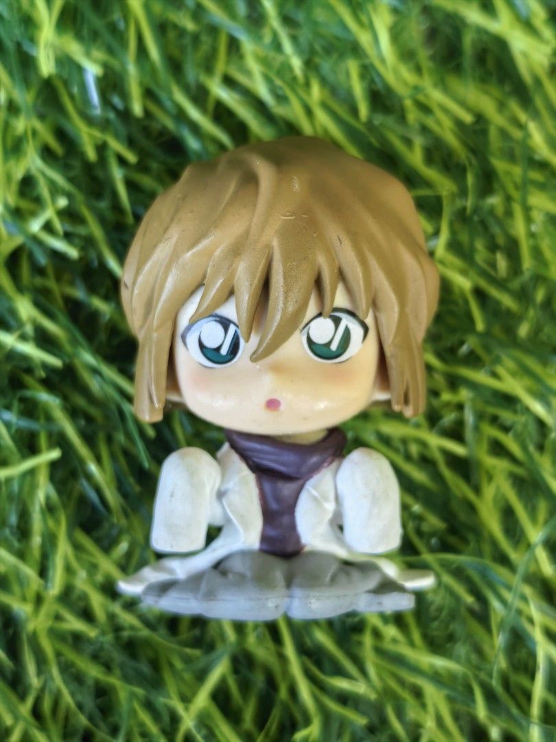 Detective Conan Ai Haibara Mini Figure (Category: Figurines & Statues) located in Paranaque City. Submitted by furugiyafinds (Listing ID 1470628032, Image 1). Description: - Character: Ai Haibara from Detective Conan - Pose/Outfit: Sitting pose wearing a white lab coat and purple scarf - Authenticity: Back stamped with ©GA/S-Y-T B CHINA 2424434 - Condition: Loose piece, no box included - Size: Mini/compact, great for display or collection.