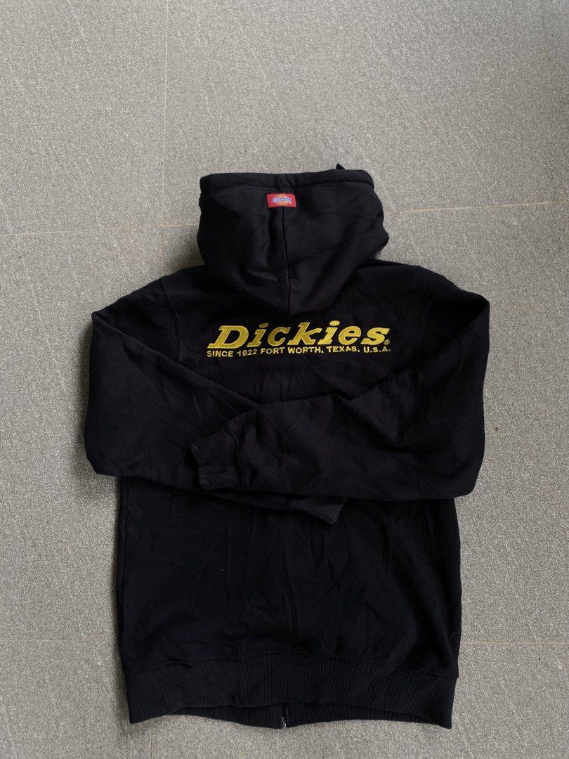 Dickies Black Zip Up Hoodie Size Small (Category: Hoodies) located in Manila. Submitted by smart_archives2000 (Listing ID 1470613158, Image 2). Description: - Brand: Dickies - Color: Black with yellow embroidery - Size: Small - Details: Yellow embroidered chest logo and large back lettering (Dickies Since 1922 Fort Worth, Texas, U.S.A.) - Features: Red logo tags on hood and hem, front kangaroo pockets, and adjustable drawstring hood - Condition: 