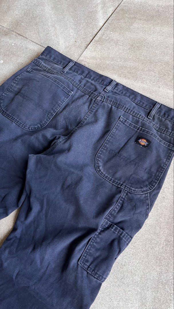 Dickies Dark Navy Blue Cargo Work Pants Size 38x30 (Category: Trousers) located in Cabuyao City. Submitted by bulandos (Listing ID 1470656577, Image 3). Description: Dickies work pants in dark navy blue. Cotton blend fabric with utility pockets on the leg and back pockets with the logo tag. Size 38x30 printed on the inner waist tag. Sturdy material with some wear at the hems and a small mark on the front leg..