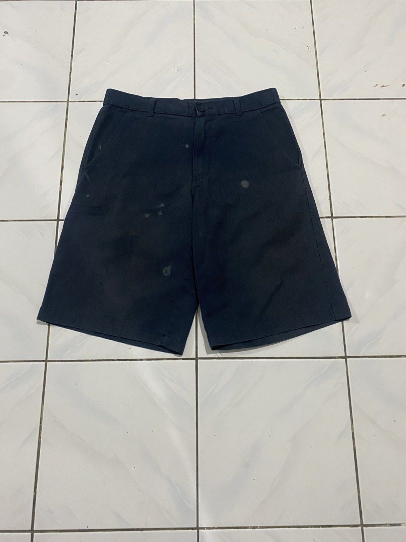 Dickies Navy Blue Work Shorts (Category: Shorts) located in Cavite. Submitted by findsmore (Listing ID 1470742774, Image 1). Description: - Brand: Dickies - Color: Navy Blue - Style: Classic work shorts with belt loops and standard pockets - Details: Signature Dickies logo patch on the back pocket - Condition: Durable fabric with noticeable staining and wear marks on the front - Best For: Everyday workwear, DIY projects, or casual utility wear.