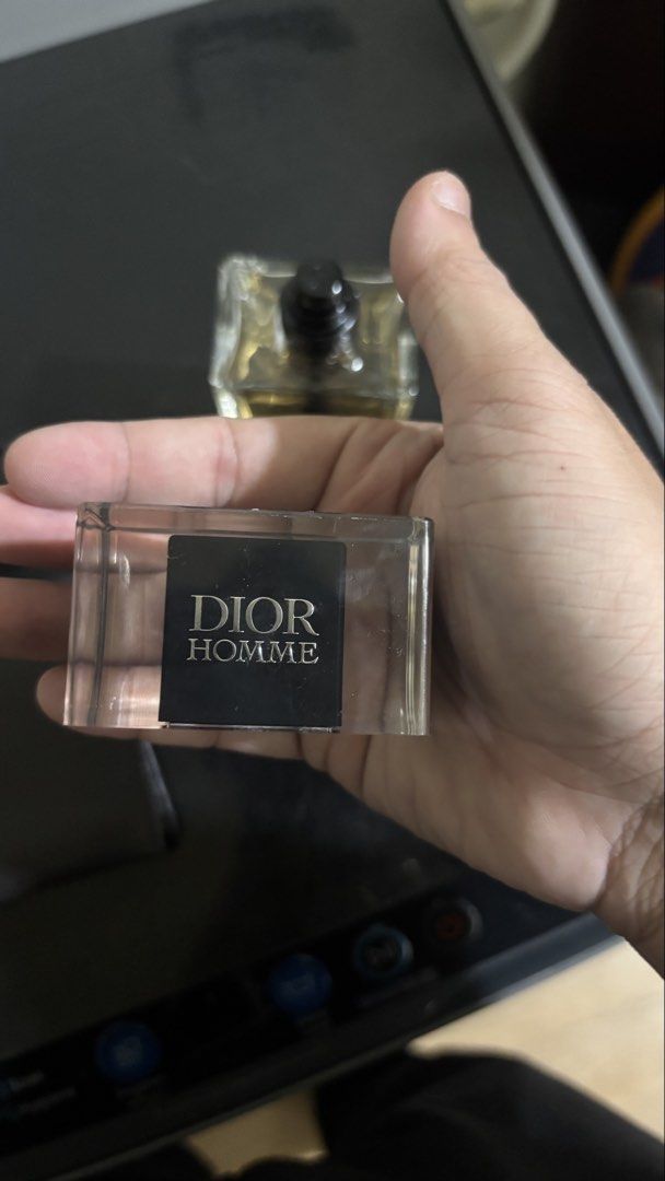 Dior Homme Eau de Toilette 100ml (Category: Fragrance & Deodorants) located in Las Pinas. Submitted by jonbrylle (Listing ID 1470742511, Image 3). Description: - Authentic Dior Homme 100ml fragrance - Liquid level is near the top (barely used) - Features heavy clear glass bottle with black inner tube design - Smoothly working spray mechanism - Includes original cap with the iconic bee logo inside.