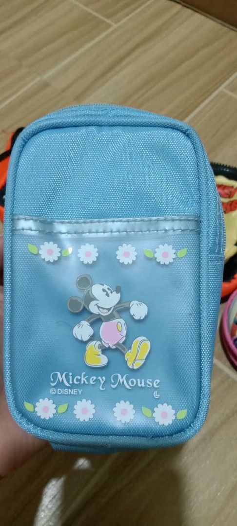 Disney Mickey Mouse Donald Duck Daisy Pouch Bundle Set (Category: Purses & Pouches) located in Gapan. Submitted by montesnora80204 (Listing ID 1470565593, Image 2). Description: Bundle of Disney character pouches and coin purses. Includes a bright orange multi-pocket waist bag with Mickey and blue accents, a light blue Mickey Mouse pencil case with clear front window, a purple Daisy and Donald Duck coin pouch with star pattern, and a round pink M