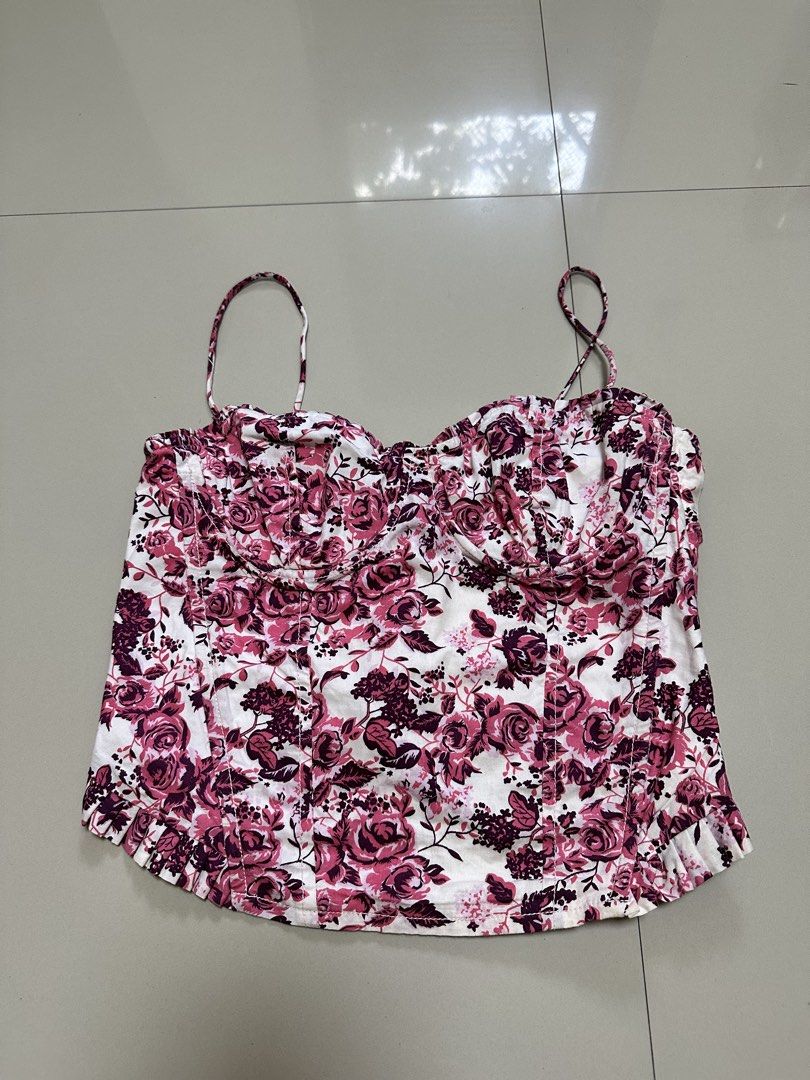 Divided floral corset top (Category: Others Tops) located in Davao. Submitted by theresetshelf (Listing ID 1470614993, Image 1). Description: • Adjustable spaghetti straps • Structured underwire bust cups (unpadded/lightly padded) • Corset-inspired paneling and boning details • Feminine frill/ruffle hem detailing side zipper adjustable at the back.