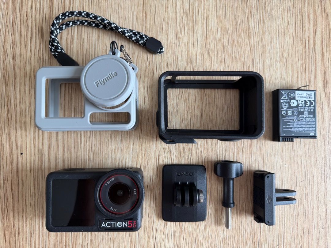 DJI Osmo Action 5 Pro with Accessories (Category: Cameras) located in Valenzuela. Submitted by ellie018 (Listing ID 1470650630, Image 1). Description: Complete DJI Osmo Action 5 Pro setup, perfect for vlogging and adventures - Includes grey Flymile silicone case with matching lens cap and strap - Comes with a black protective frame housing - Includes a spare battery so you never miss a shot - Comes with mounting base, thumb screw, and quick-relea